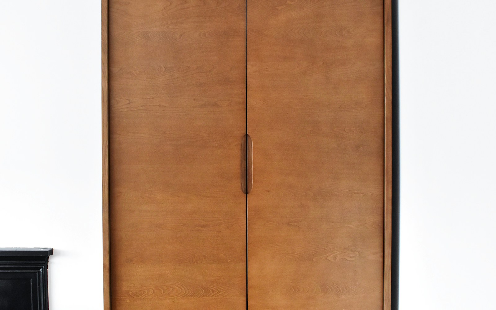Clothes arranged in a bright, compact home closet
