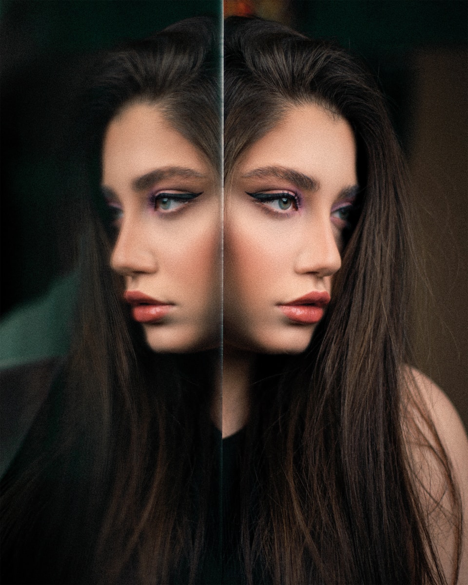a woman's face is reflected in a mirror